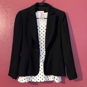 White and black polkadot shirt